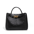 Women's luxe handbag with weaving and gold details