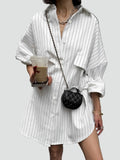 White long oversized women's striped shirt with pockets