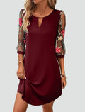 Cocktail dress with embroidered sleeves and cutout