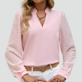 Light women's blouse with long sleeves and V-neckline