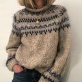 Warm women's oversized sweater with a Norwegian pattern