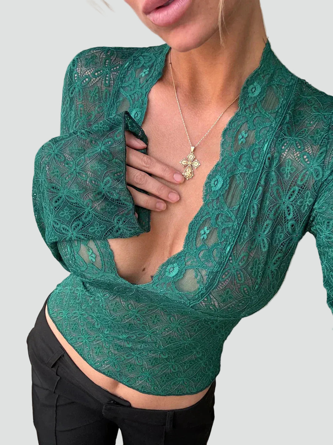 Lace blouse with a deep neckline and long sleeves
