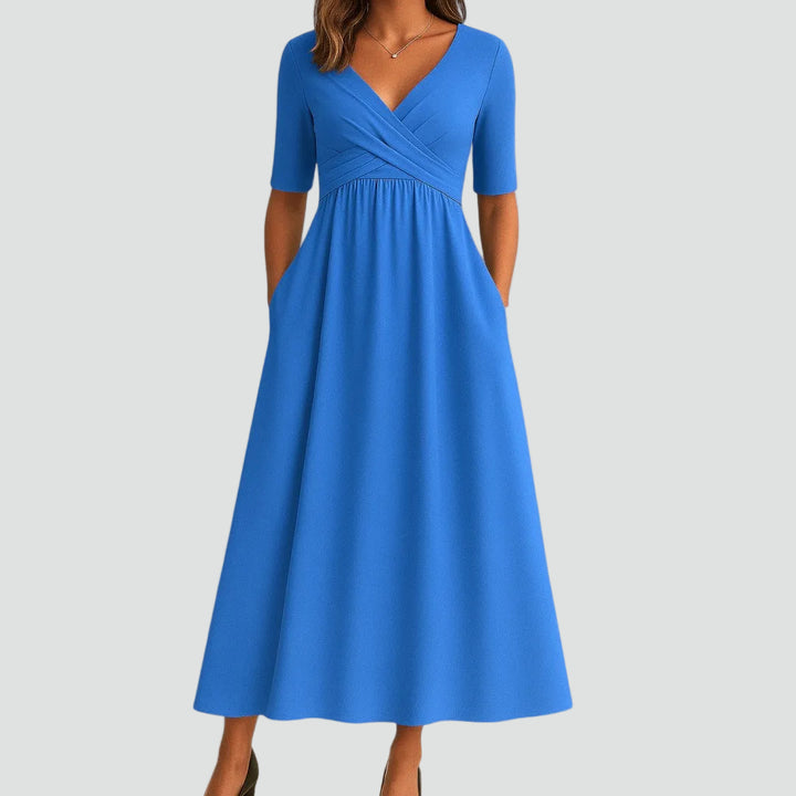 Sukienka midi koktajlowa z kopertowym dekoltem i kieszeniami