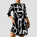 Mini party dress with abstract print and 3/4 sleeve