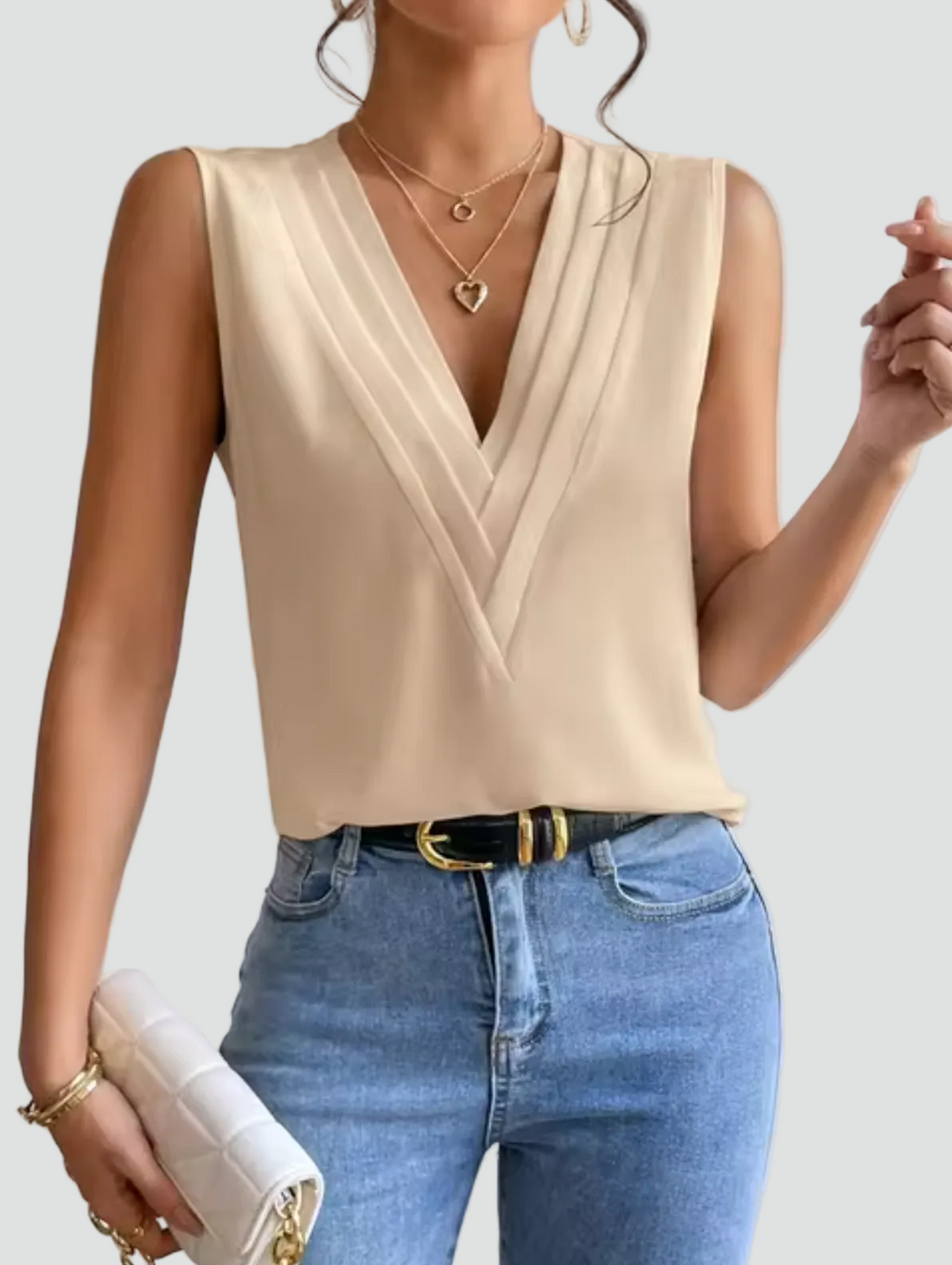 Elegant sleeveless blouse with a wrap neckline