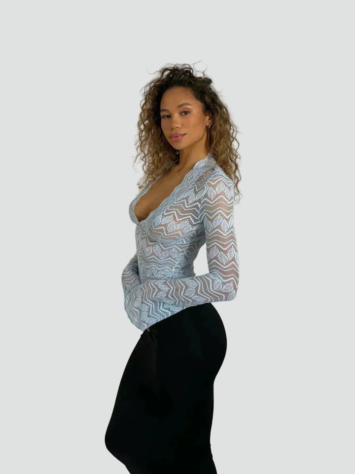 Lace blouse with a deep neckline and long sleeves