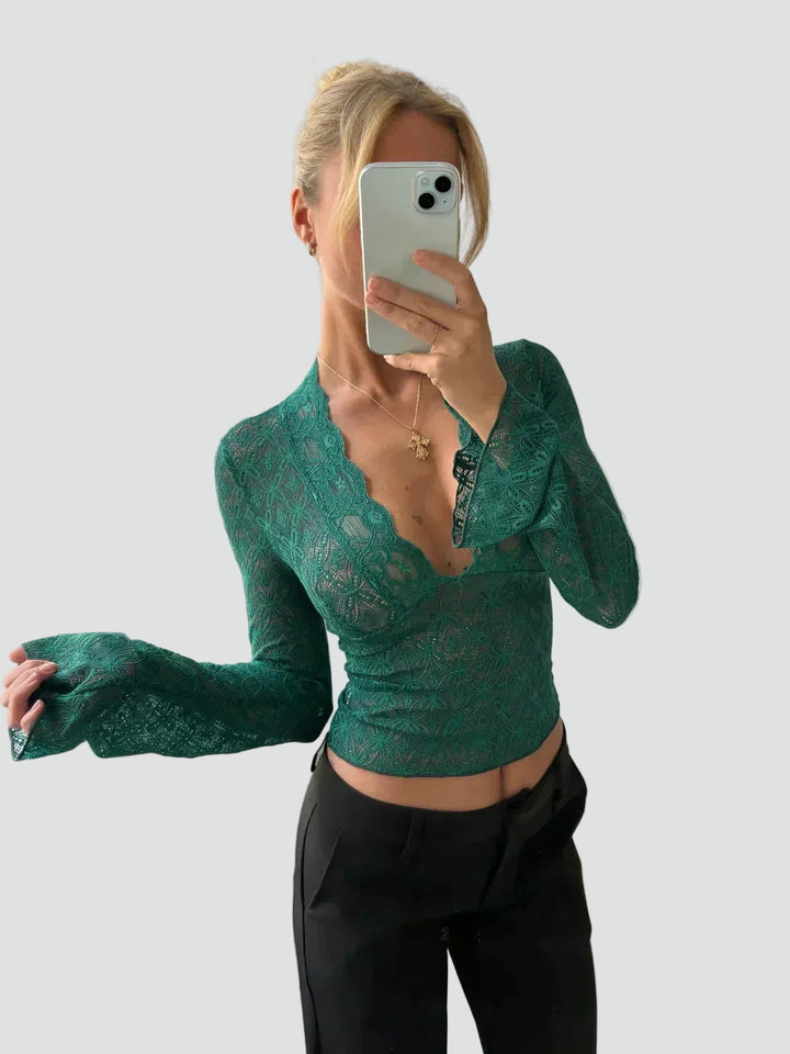 Lace blouse with a deep neckline and long sleeves