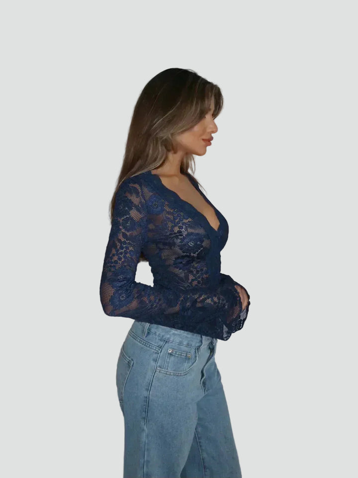Lace blouse with a deep neckline and long sleeves