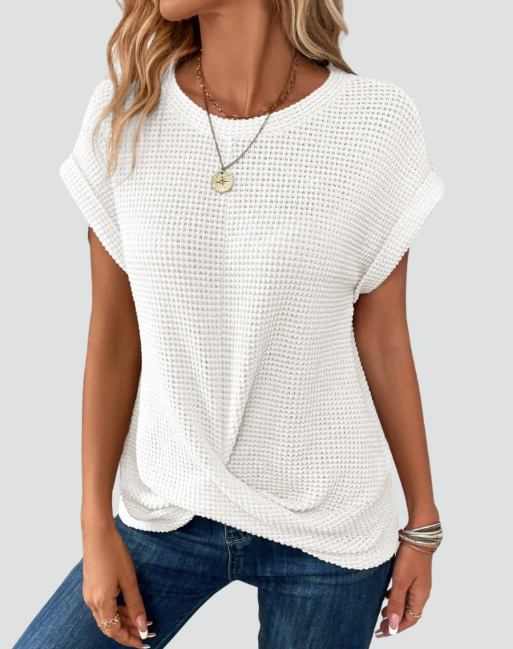 Knit top with short sleeves and a crossover hem