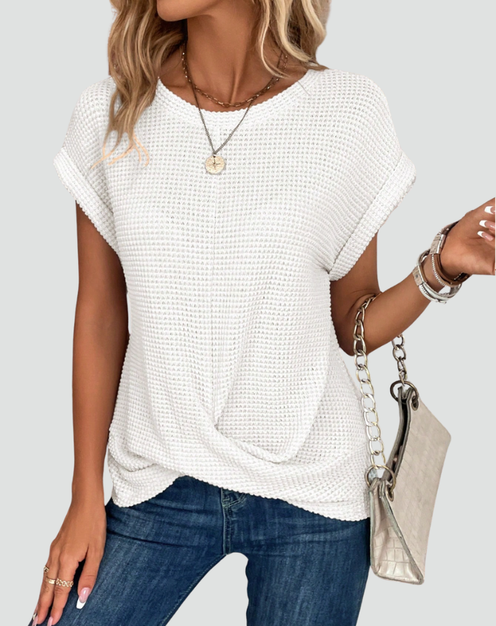 Knit top with short sleeves and a crossover hem