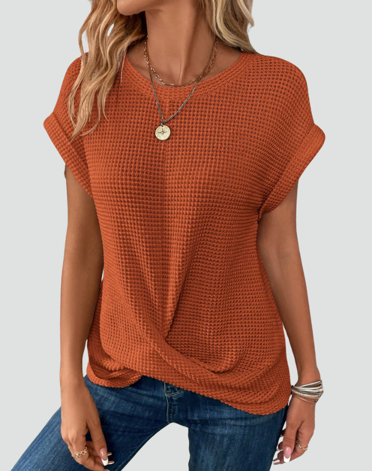 Knit top with short sleeves and a crossover hem