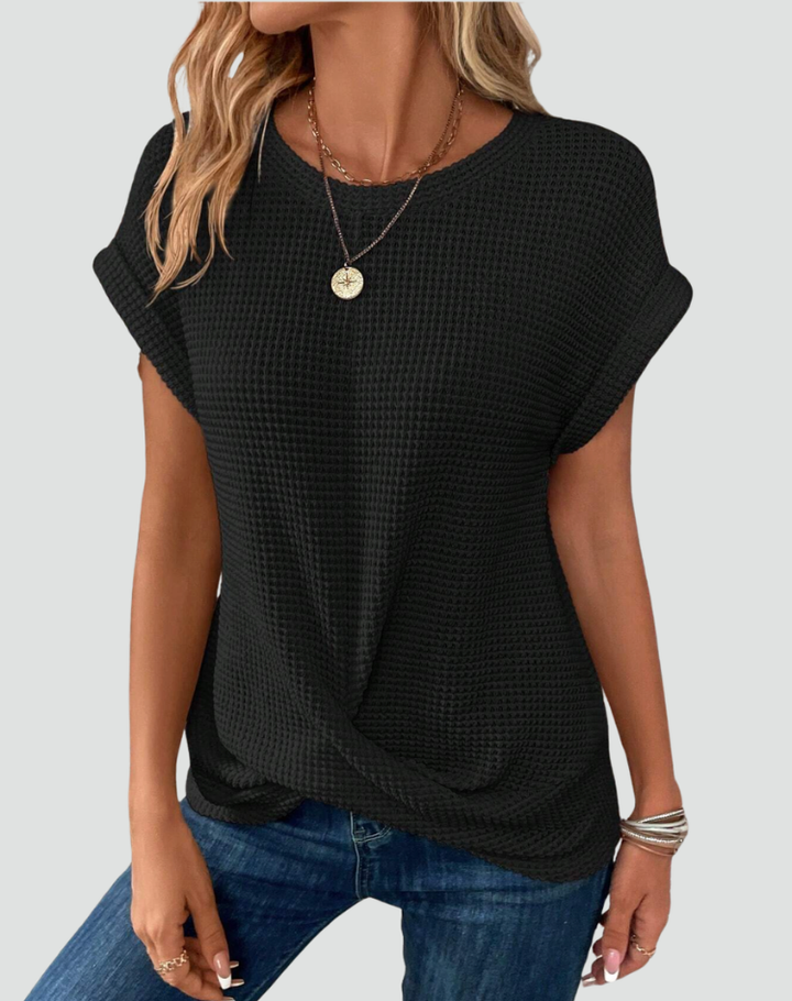 Knit top with short sleeves and a crossover hem