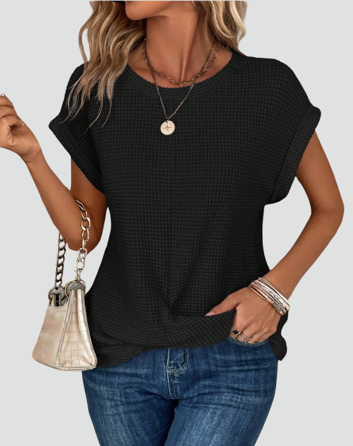 Knit top with short sleeves and a crossover hem