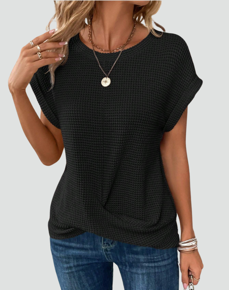 Knit top with short sleeves and a crossover hem