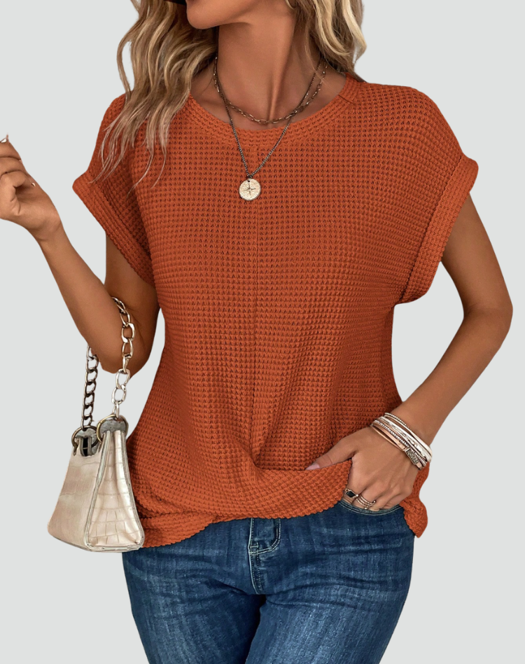 Knit top with short sleeves and a crossover hem