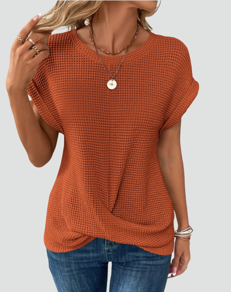 Knit top with short sleeves and a crossover hem