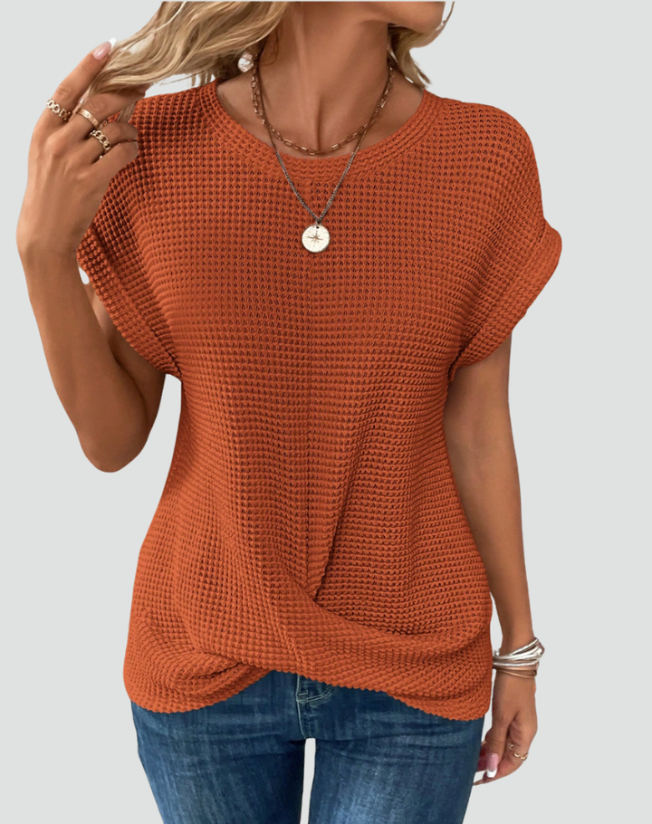 Knit top with short sleeves and a crossover hem
