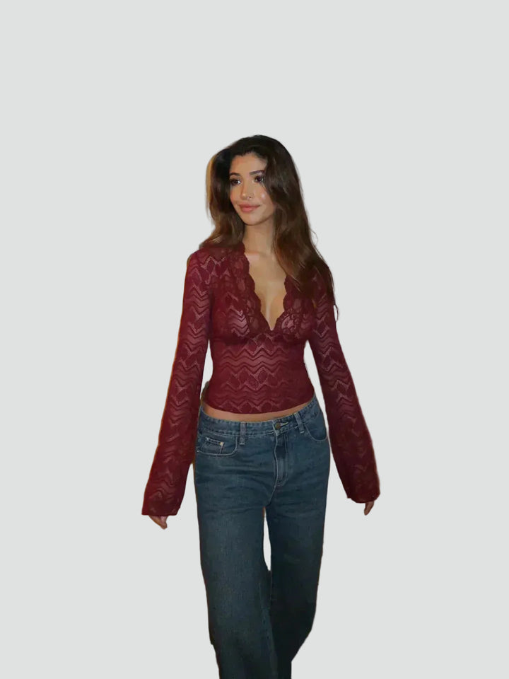 Lace blouse with a deep neckline and long sleeves