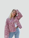 Short pink quilted women's jacket with floral pattern