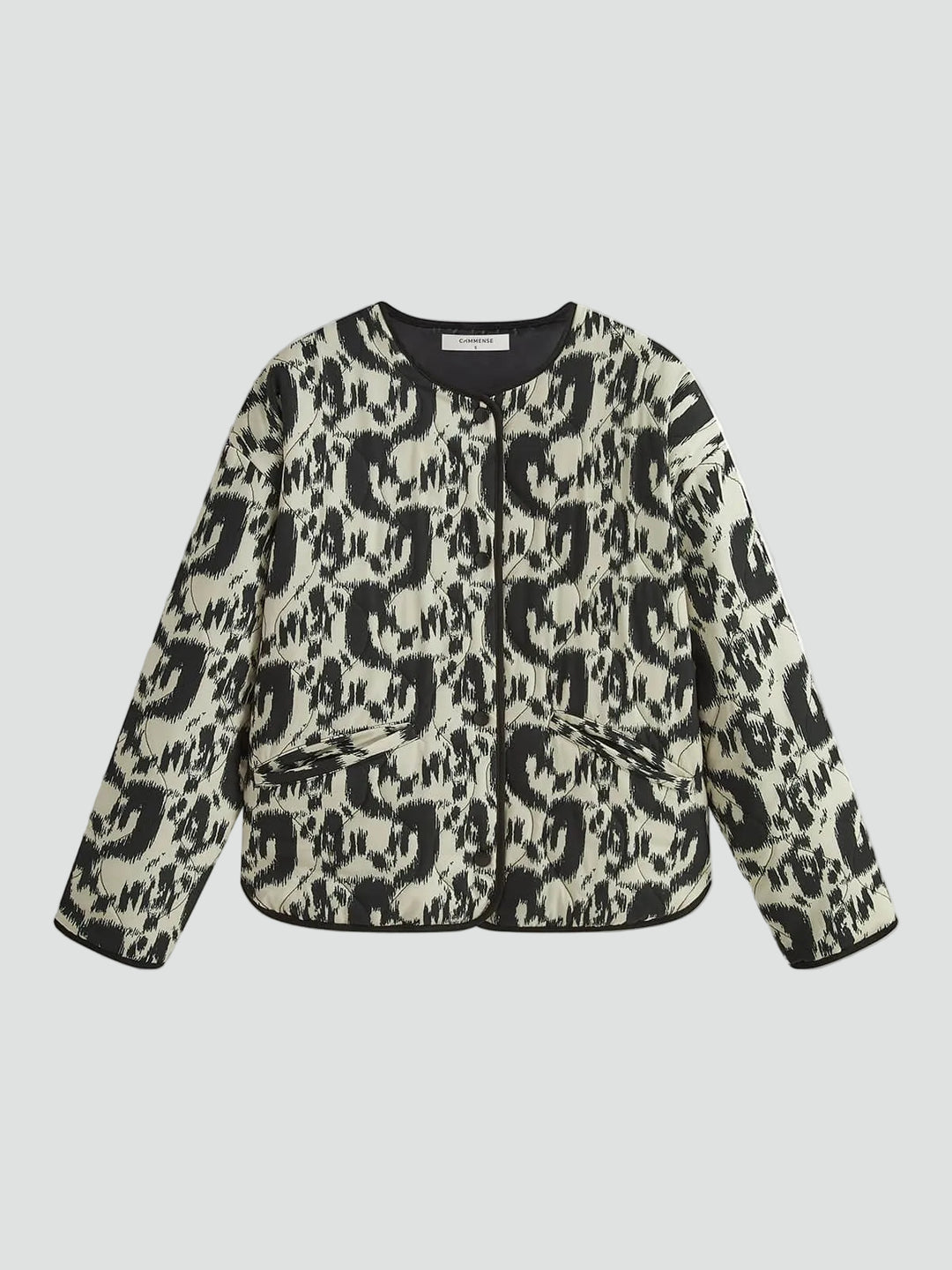 Patterned quilted jacket without collar with decorative trim