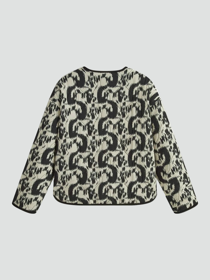 Patterned quilted jacket without collar with decorative trim