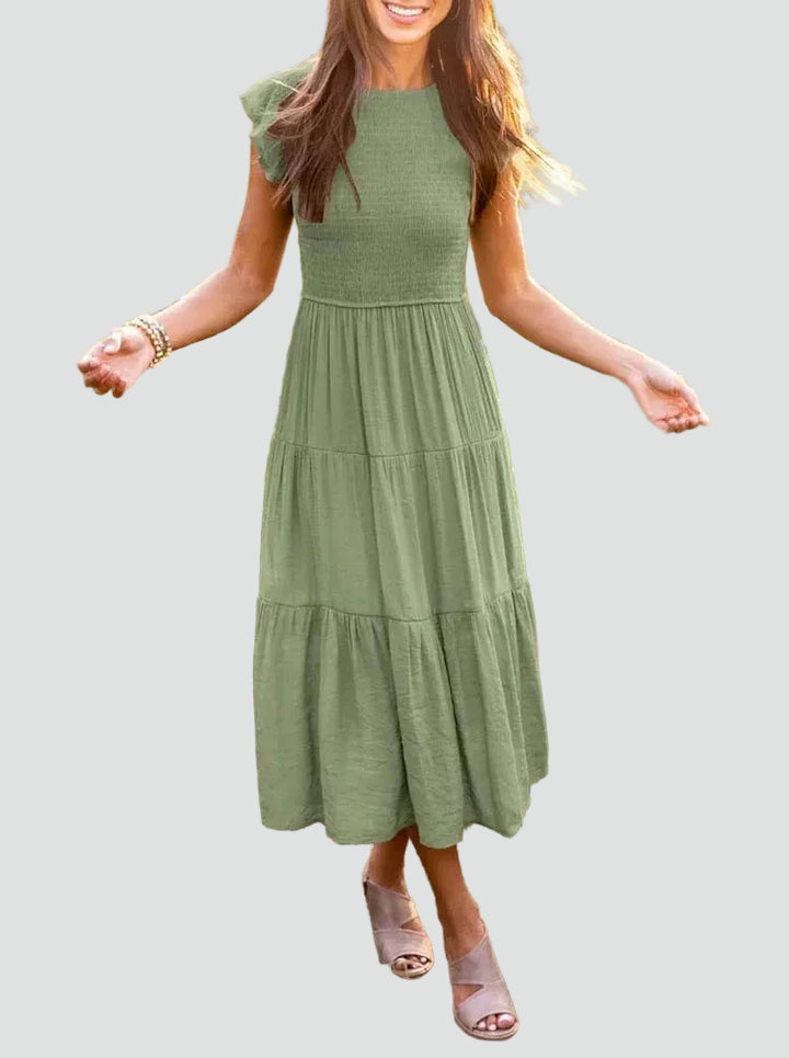 Comfortable midi dress with ruffles on the sleeves and a loose fit