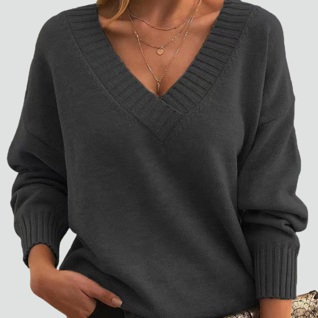 Classic sweater for women with V-neck and ribbed cuffs