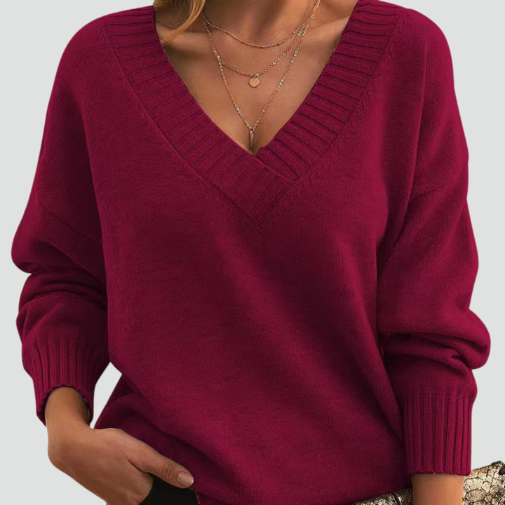 Classic sweater for women with V-neck and ribbed cuffs
