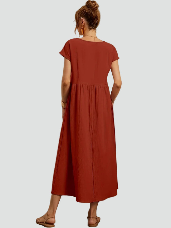 Zwiewna sukienka midi z krótkim rękawem i kieszeniami