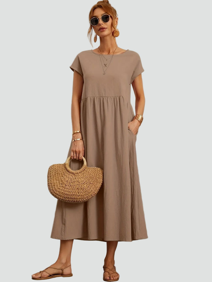 Zwiewna sukienka midi z krótkim rękawem i kieszeniami