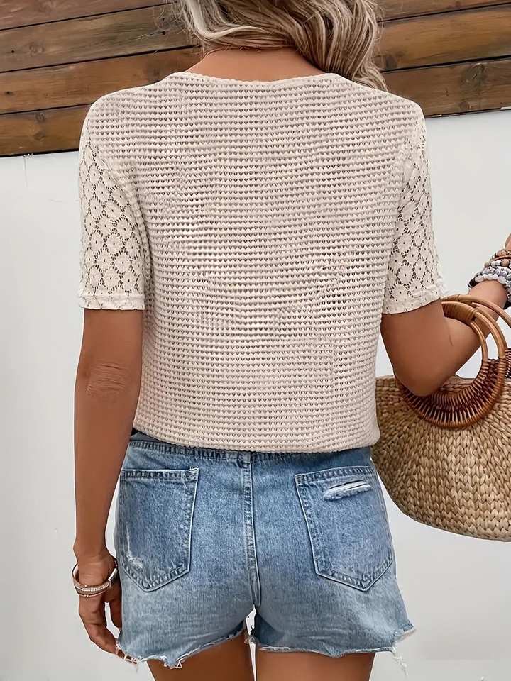 Beige knit blouse with V-neck and short sleeves