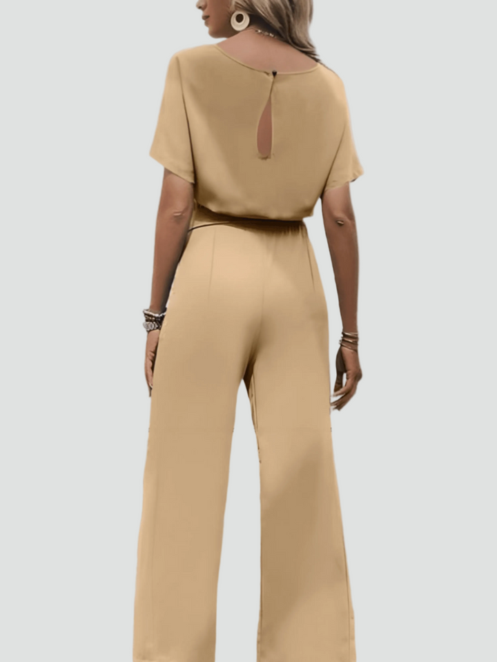 Elegant women's jumpsuit with short sleeves and waist belt