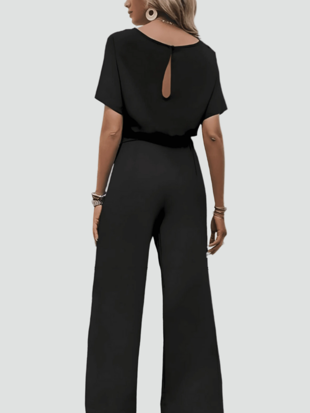Elegant women's jumpsuit with short sleeves and waist belt
