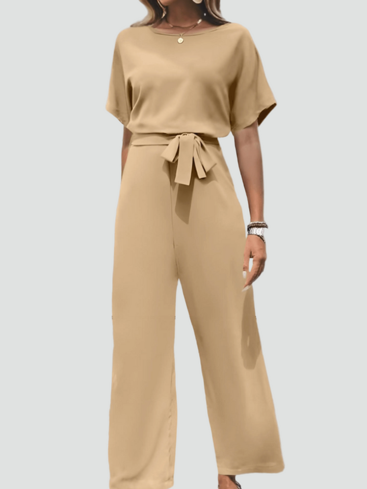 Elegant women's jumpsuit with short sleeves and waist belt