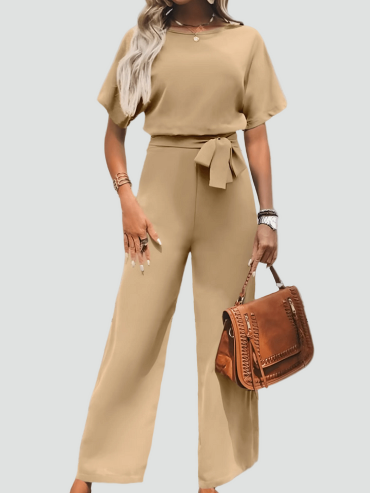 Elegant women's jumpsuit with short sleeves and waist belt