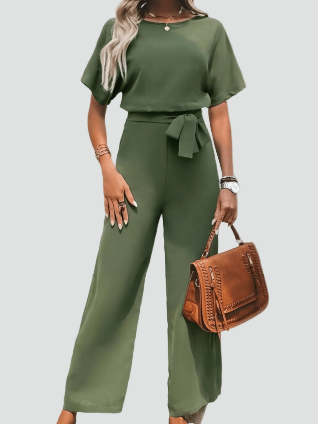 Elegant women's jumpsuit with short sleeves and waist belt