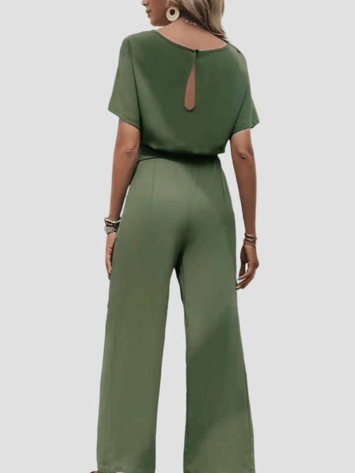 Elegant women's jumpsuit with short sleeves and waist belt