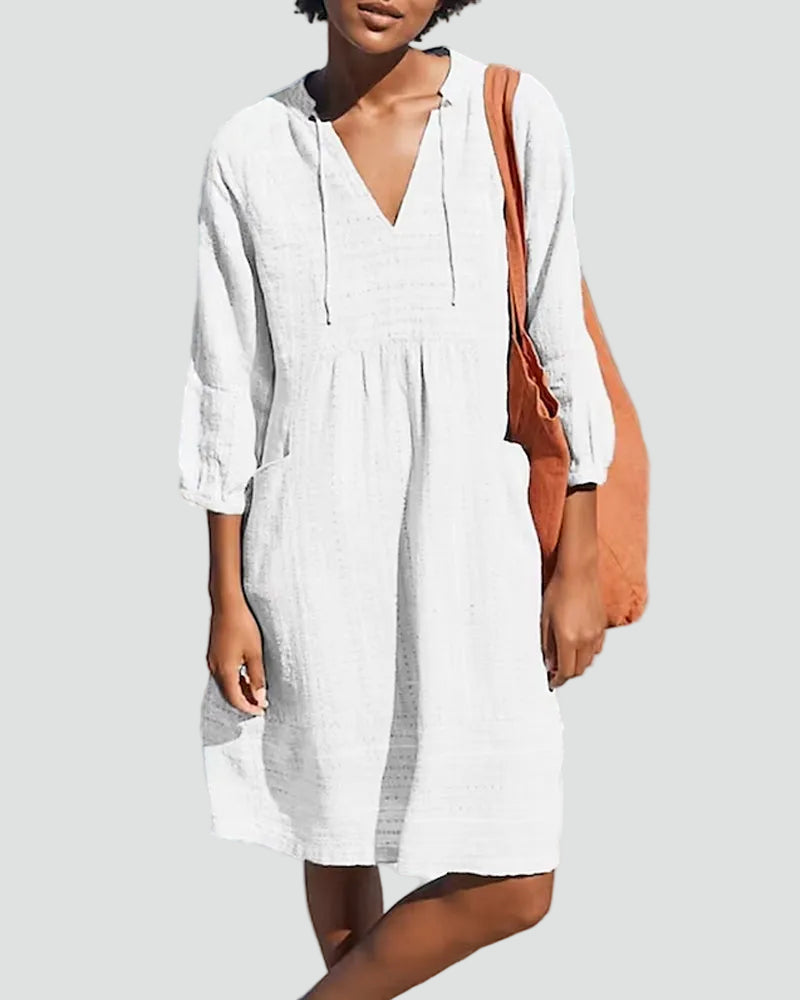 Women's loose beach dress with V-neck and three-quarter sleeves