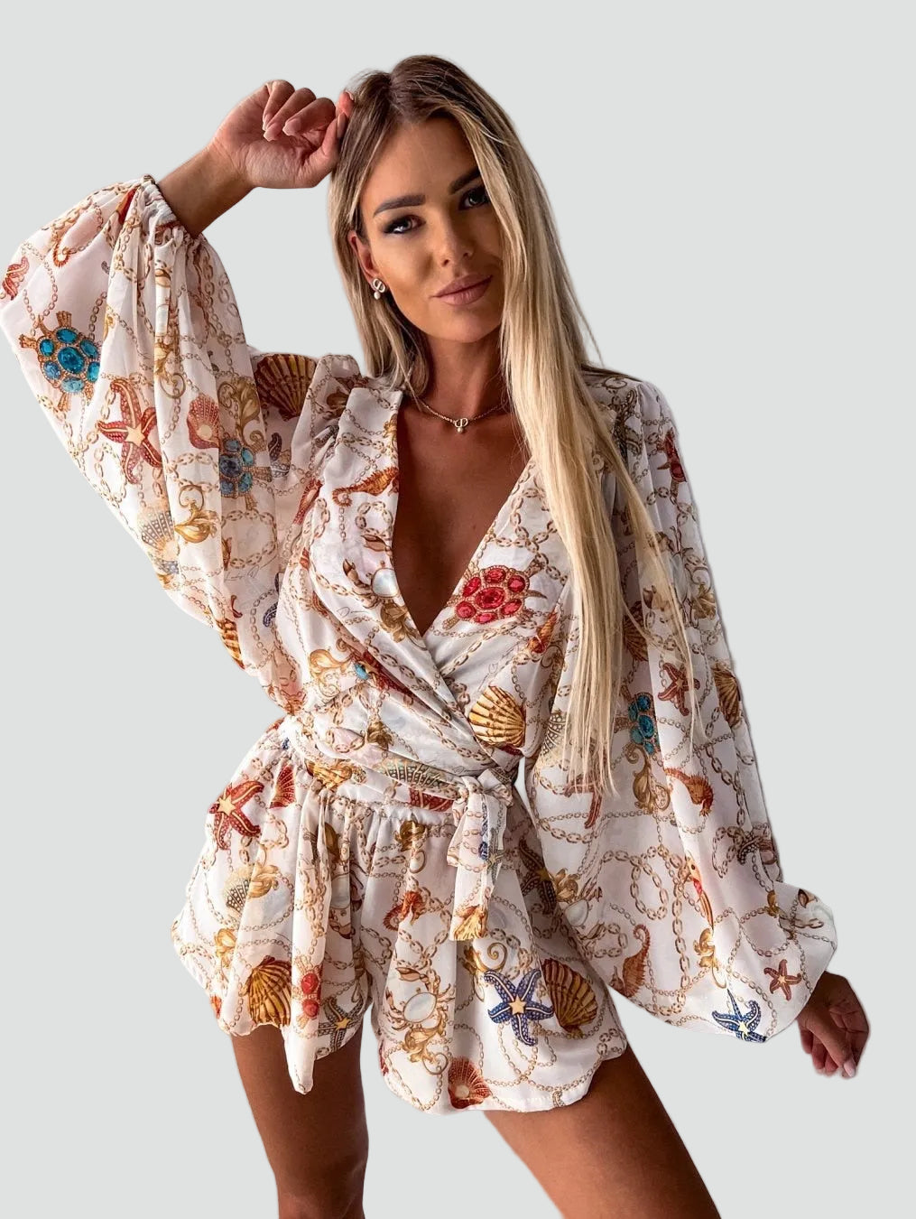 Letni kombinezon damski boho w kwiaty kopertowy z długim rękawem