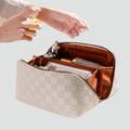 Spacious women's makeup bag with compartments for makeup and travel