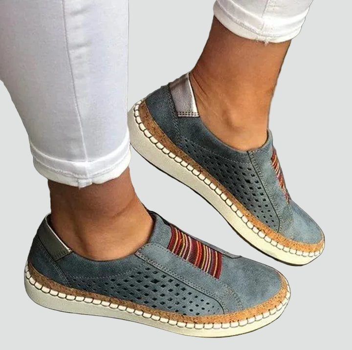 Orthopedic women's moccasins with perforation and elastic inserts