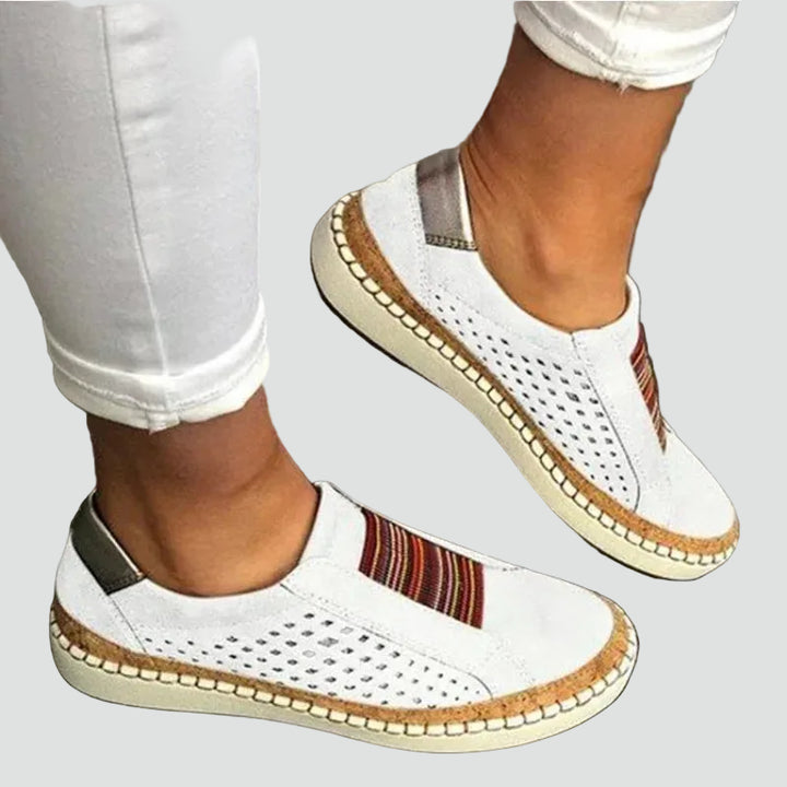 Orthopedic women's moccasins with perforation and elastic inserts
