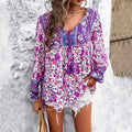 Luchtige dames tuniek met bloemen, een V-hals en kwastjes