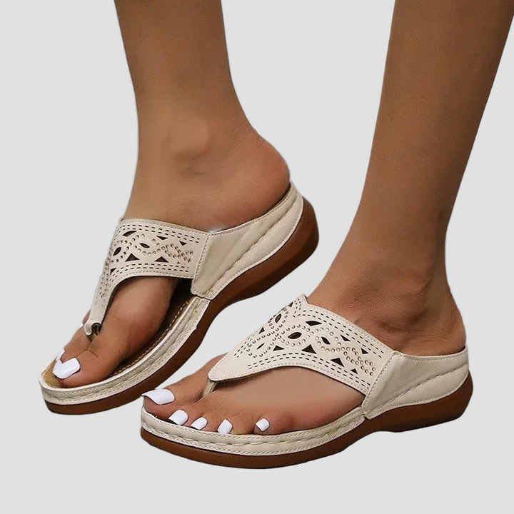 Women's flip-flops with a lace pattern and comfortable sole