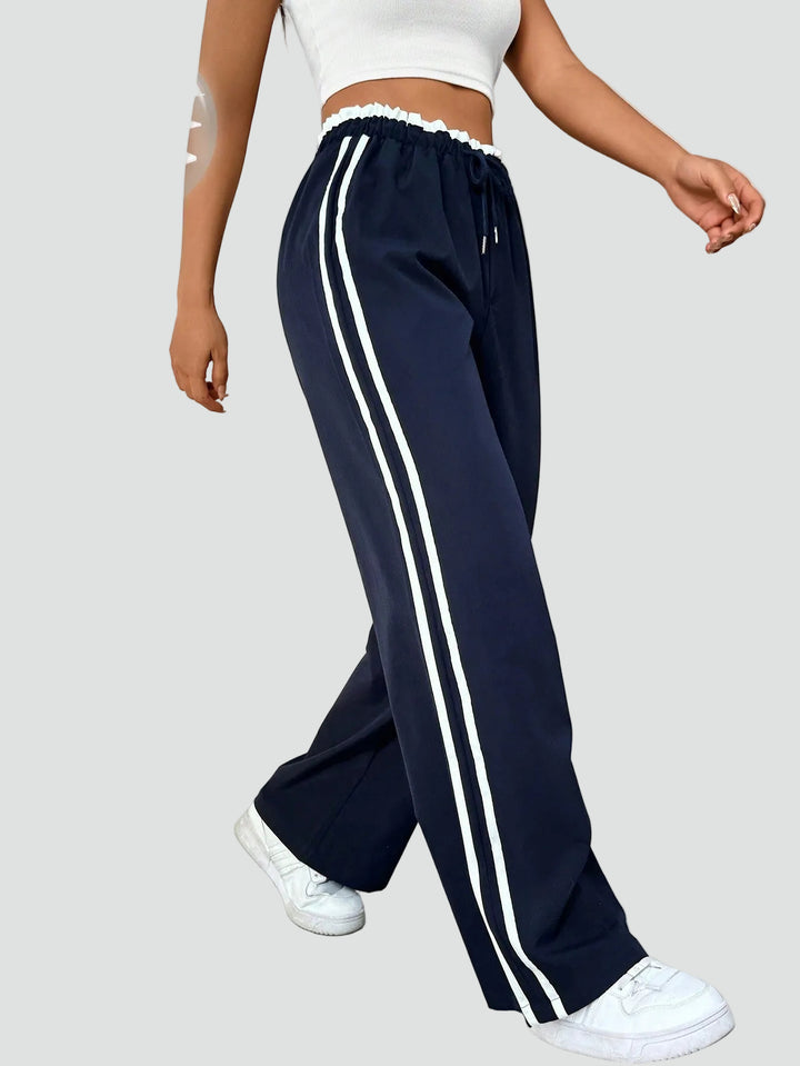 Damskie dresowe spodnie wide leg z lampasami