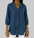 Women's denim shirt with a ruffle and V-neckline