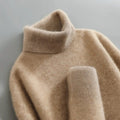 Warm women's merino wool turtleneck sweater for winter