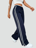 Pantalon de sport pour femmes avec bandes latérales et jambes larges