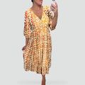 Maxi dress with a V-neckline and an elegant pattern