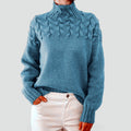 Women’s cable-knit sweater with a turtleneck neckline